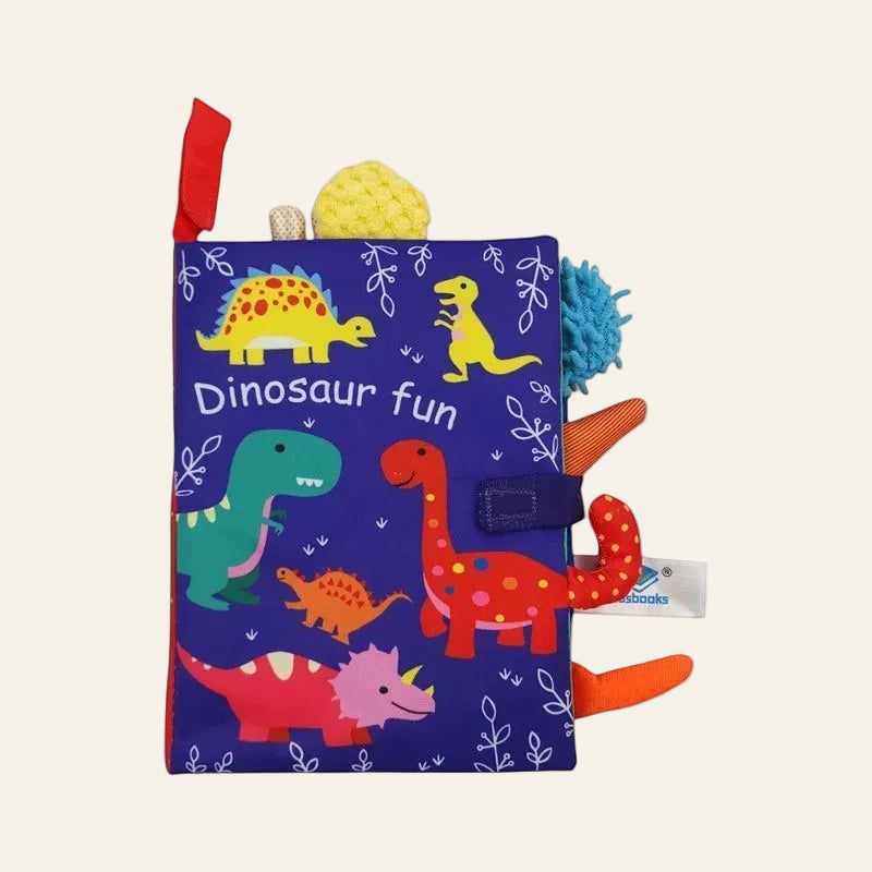 Children's soft book with colorful dinosaur illustrations on a white background