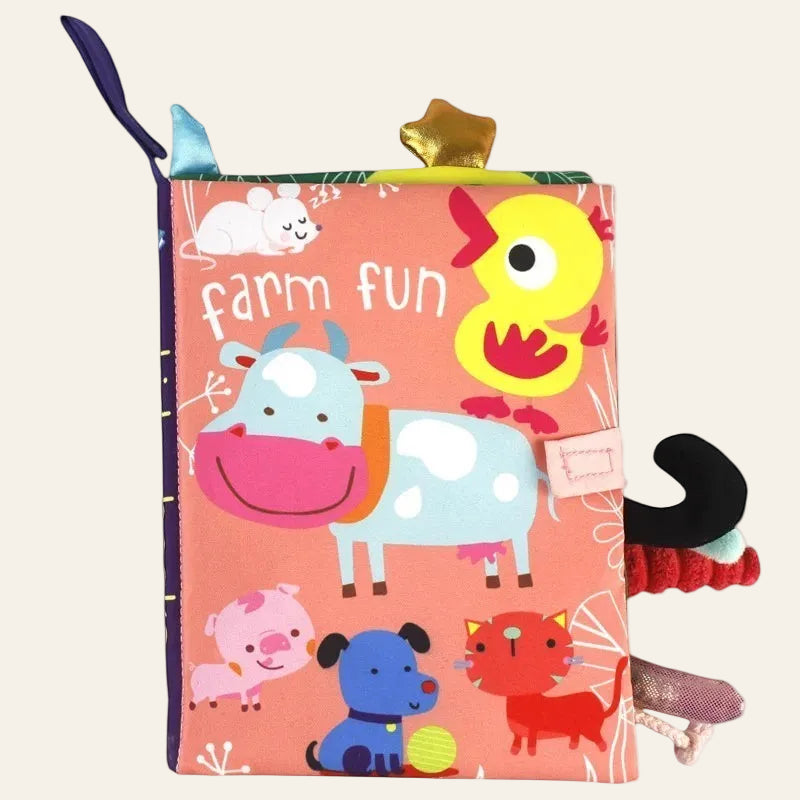 Children's soft book with farm animals on a white background