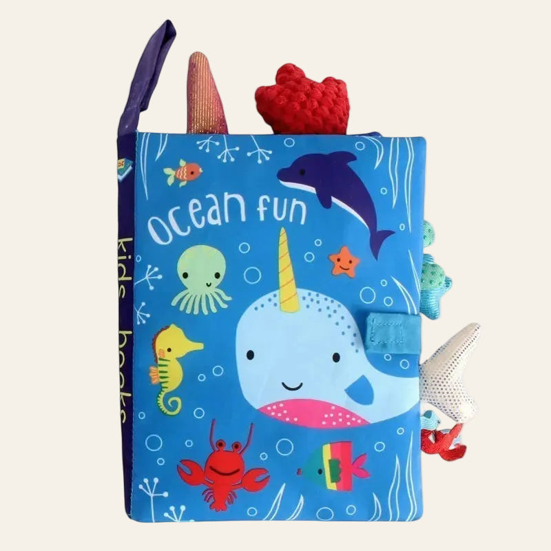 Children's soft book titled 'Ocean Fun' with colorful sea creature illustrations on a white background.